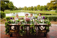 Bride and Groom and Wedding Party Members Seated at Table