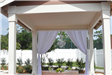 Courtyard Gazebo with White Drapes and Fence