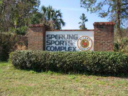 Sperling Sports Complex Sign Bordered by Bushes