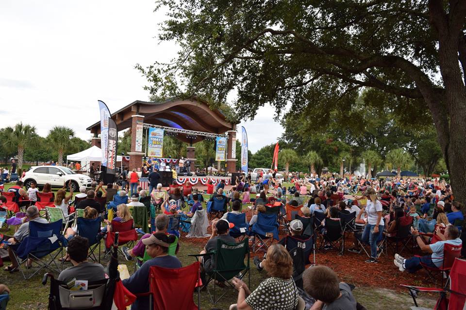 People Gathering at Earl Brown Park Stage for Concert