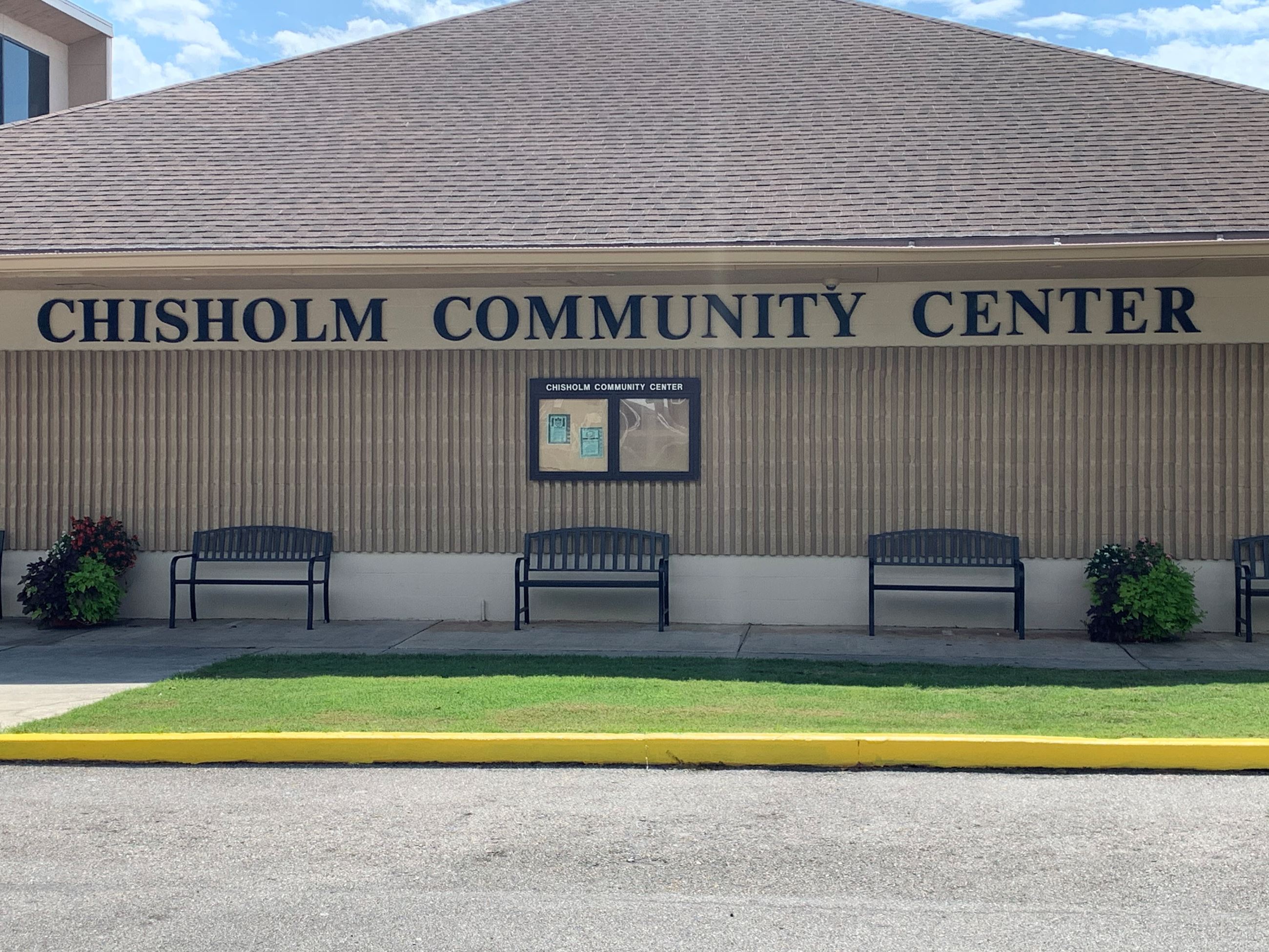 Chisholm Community Center Building and Shaded Benches